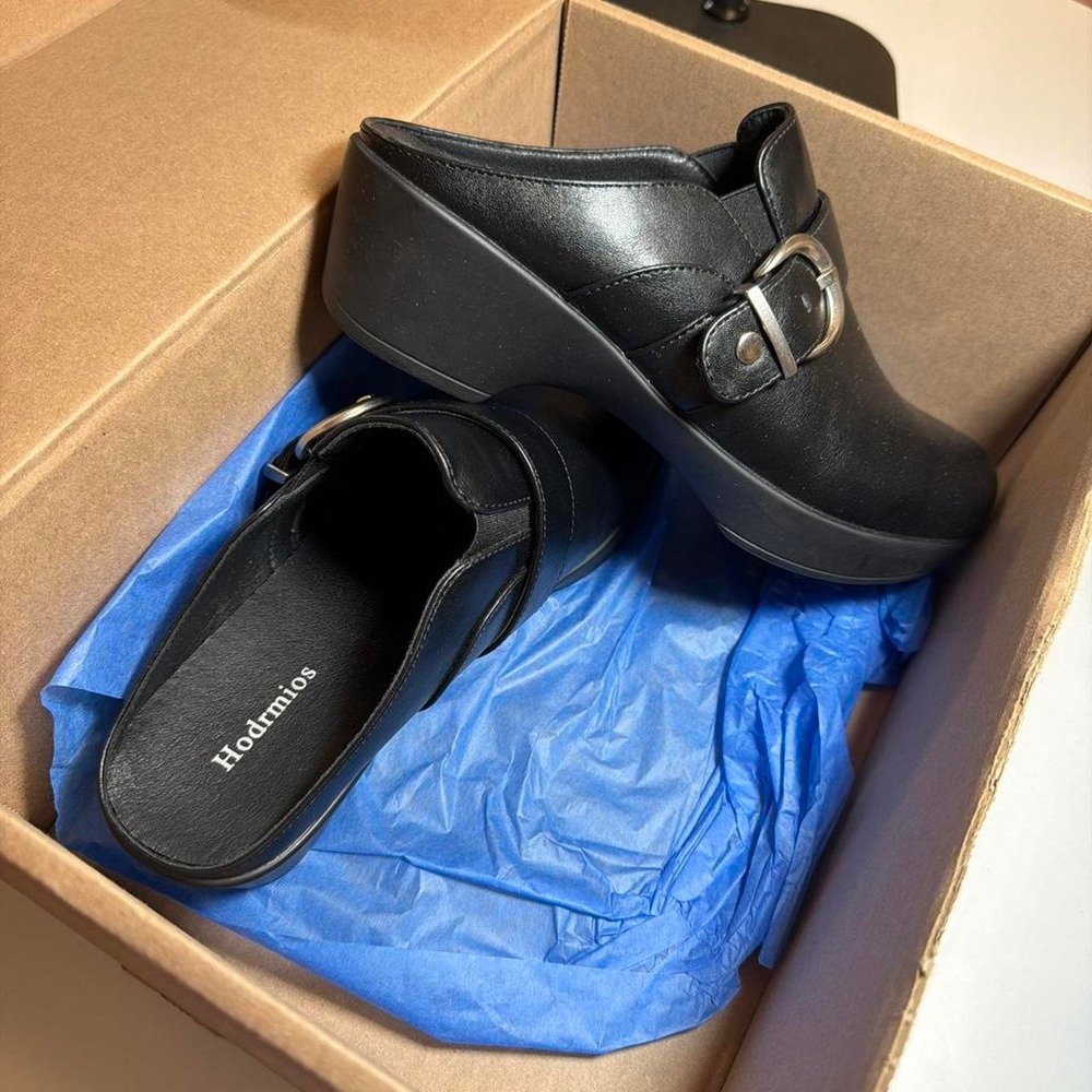 Black leather clogs with buckle detail